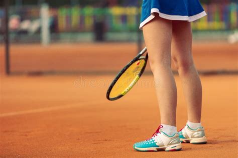 Beautiful Female Athlete With Perfect Body Posing On Tennis Court