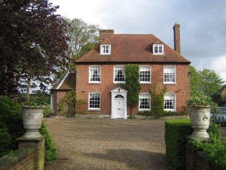 Stately red brick exterior with wrought iron accents compliment this classic. Georgian Red Brick House | Red brick house