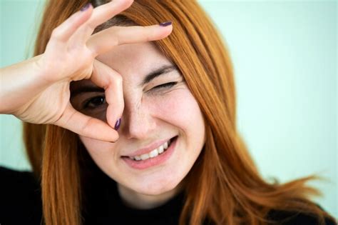 Premium Photo Funny Pretty Redhead Girl Showing Ok Sign With Her Fingers