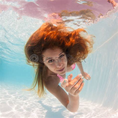 Underwater Woman Portrait Wearing Black Bikini In Swimming Pool Stock