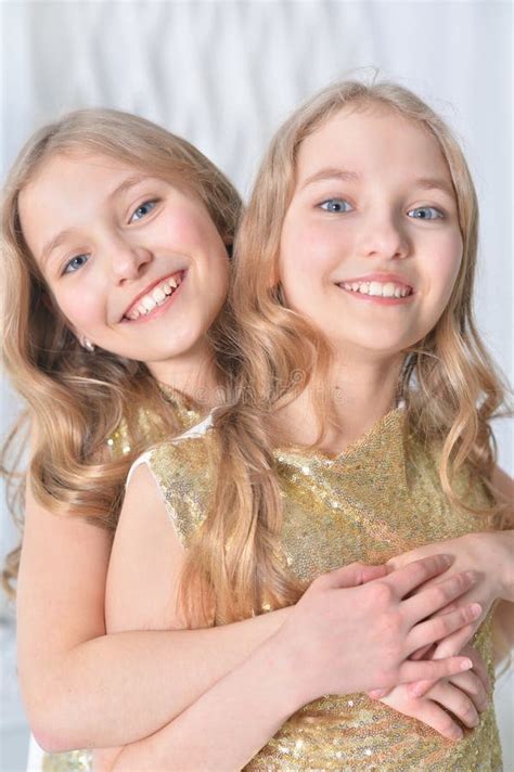 Portrait Of A Cute Twin Sisters Stock Image Image Of Parents