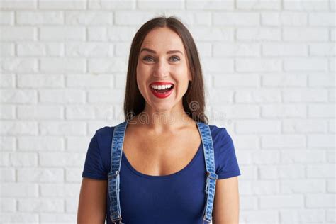 Young Amazing Woman Standing Against A White Wall Stock Image Image