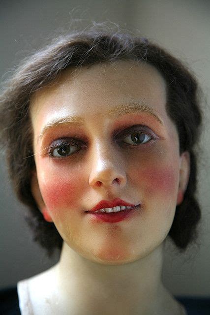 A Close Up Of A Mannequins Head With Makeup