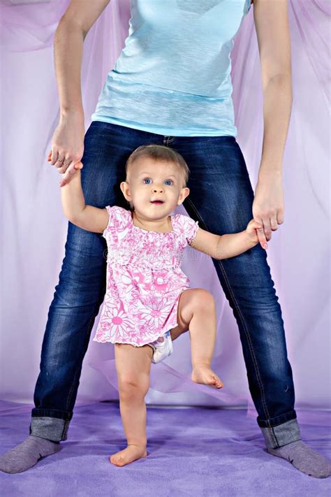 Baby Standing Between Mother S Legs Stock Image Image Of Baby