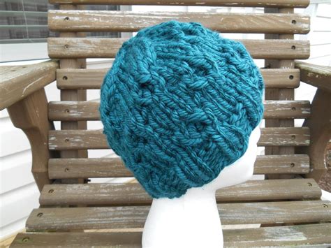 This cozy bulky knit hat is not only perfect to keep you warm during the cooler months, but can easily be extended into a super cute beanie. Super Bulky Whirls of Hope Hat | AllFreeKnitting.com