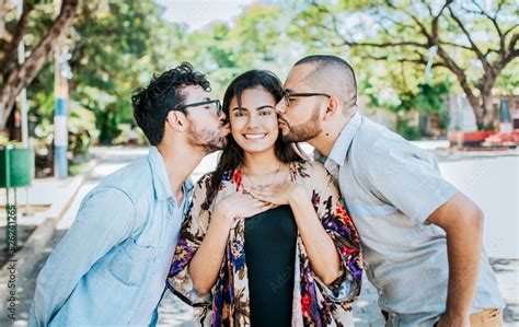 Two Men Kissing A Girl Cheek Portrait Of Two Guys Kissing A Girl Cheek