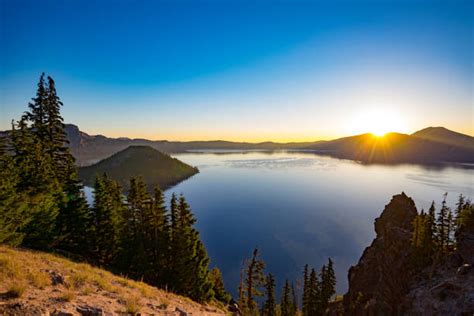 Crater Lake Sunrise Stock Photos Pictures And Royalty Free Images Istock