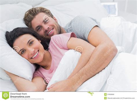 Couple Embracing In Bed Royalty Free Stock Image - Image: 31669666