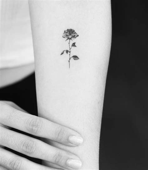 Rose is the only flower that has some manner of praying hands tattooed with a bunch of roses in the form on the arm of that guy. Dainty rose tattoo | Mini tattoos, Tattoos, Dainty tattoos