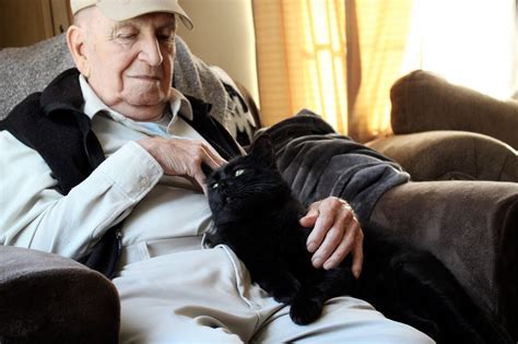 my 90 year old grandfather and my cat charlie charlie is very shy and picky with who can give