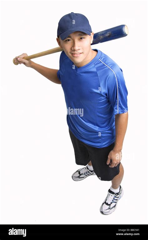 Young Man Holding Baseball Bat Smiling Up At Camera Stock Photo Alamy