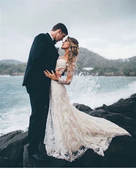 Like and follow me on facebook and instagram at www. Elopement by the Ocean | Gorgeous bride and groom photo embracing next to waves crashing against ...