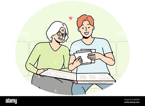 Elderly Woman And Her Son Are Looking At Old Photos In Photobook