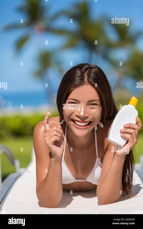 Sunscreen Woman Applying Lotion Putting Cream On Nose Beautiful Smiling Happy Asian Woman With