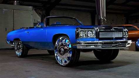 Blue Chevy Donk Convertible With A Custom Chrome Grill On 30 Inch