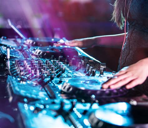 Dj Mixes The Track In The Nightclub At A Party Stock Photo Image Of