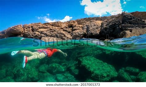Split Underwater View Woman Swimming Blue Stock Photo 2037001373
