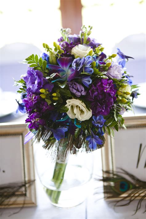 my dream bouquet blue dendrobium orchid purple white lisianthus purple stock and peacock