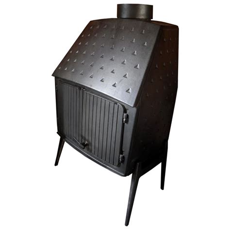 A sleek scandinavian morso wood stove replaced the previous unit, which had been situated so that its stovepipe blocked views from the kitchen and dining room. Vintage Modern Danish Black Cast Iron Wood Stove and Fireplace by Morsø, Denmark For Sale at 1stdibs