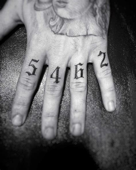 Numbers 5462 Tattooed On The Left Hands Fingers Finger Tattoos