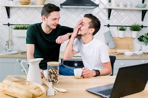 Premium Photo Happy Gay Couple Drinking Coffee And Having Fun Together Everyday Morning