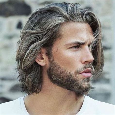 Pulling hair back with a drop of serum to ensure maximum shine, one can either conserve the natural part or pull hair directly back for a slightly more disheveled appeal. How To Grow Your Hair Out For Men: Tips For Growing Long Hair (2020) | Long hair styles men ...