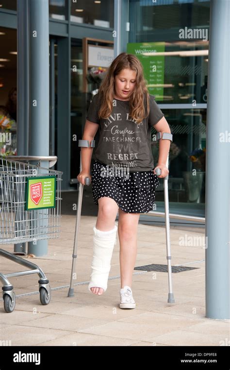 Young Girl On Crutches With Broken Leg In Plaster Fully Model Stock