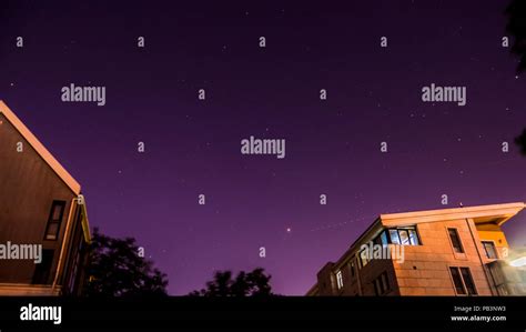 Purple Night Sky With Stars And Buildings Stock Photo Alamy