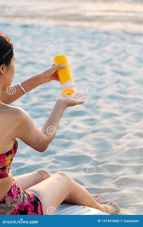 Woman Using Sun Lotion On The Beach Stock Photo Image Of Moisturizer Protection