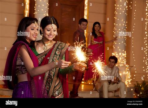 Women Playing With Sparklers Stock Photo Alamy