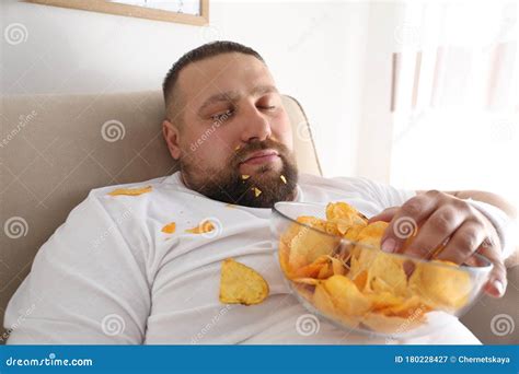 Lazy Overweight Man Eating Pizza While Laying On A Bed Royalty Free Stock Photo Cartoondealer