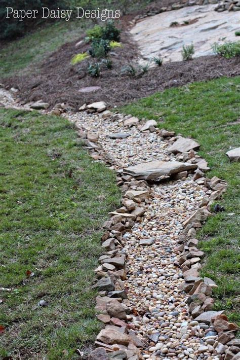 A Dry Creek Bed For Beauty And Drainage River Rock Landscaping