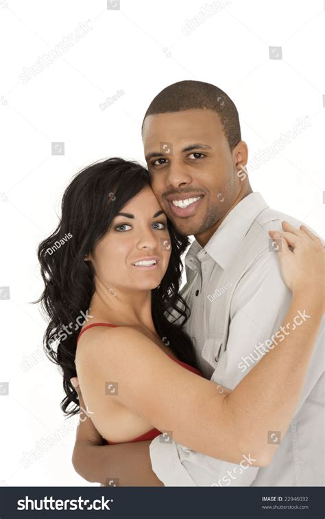 Interracial Couple Sharing And Intimate Moment Stock Photo