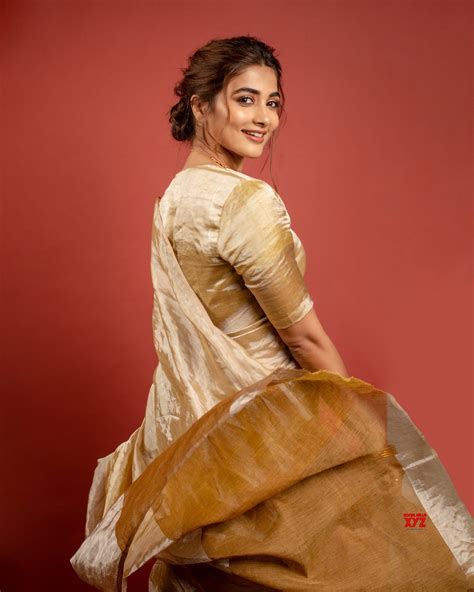 actress pooja hegde new hd stills in a golden saree social news xyz