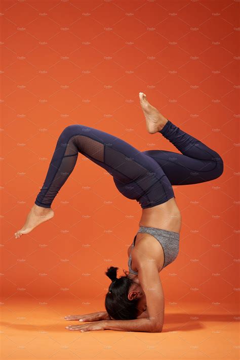 Handstand with split yoga pose | High-Quality Sports Stock Photos ~ Creative Market