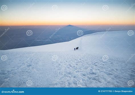 Climbers Climbing Mount Ararat Along The Steep Slope Of The Glacier In Front Of The Summit Stock