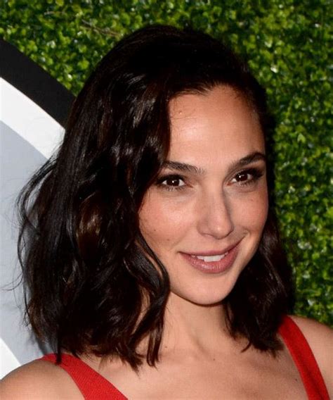 Gal Gadot Medium Wavy Layered Black Bob Haircut With Side Swept Bangs