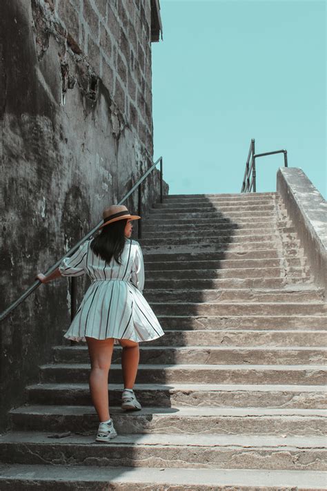 Photo Of Woman Using The Stairs · Free Stock Photo