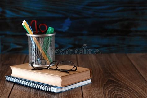 Stand With Pencils Books On A Wooden Table Stock Image Image Of