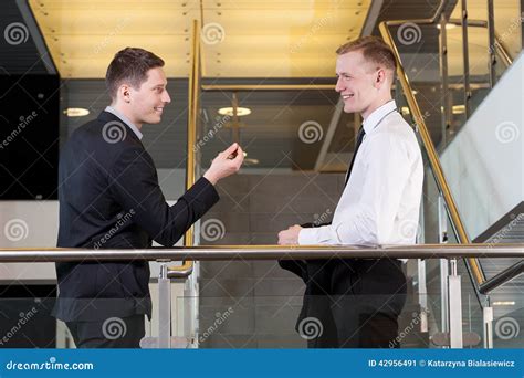 Two Businessmen Talking To Each Other Stock Image Image Of Company