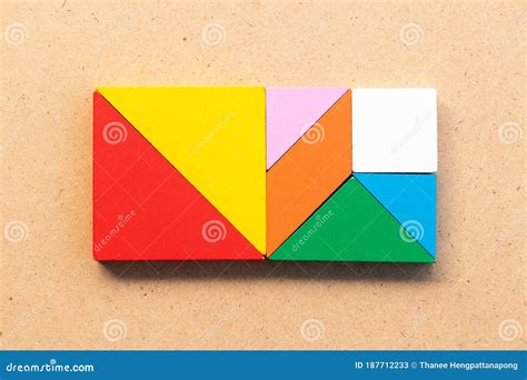 Color Tangram In Square Shape On Wood Background Stock Image Image Of
