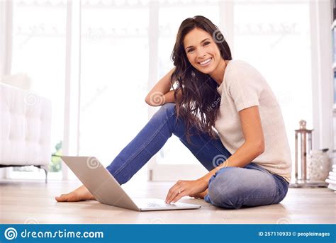 The Benefits of Working from Home. a Young Woman Sitting on the Floor