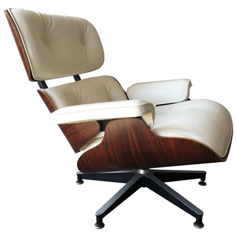 Executed in black leather and brazilian rosewood. Perfect Rosewood and Ivory Herman Miller Eames Lounge ...