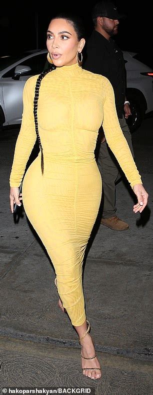 kim kardashian puts her curves on display in very tight yellow dress daily mail online