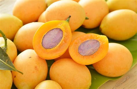 Plum Mango Tropical Fruit Produced In Summer Half Cut On Banana Leaf