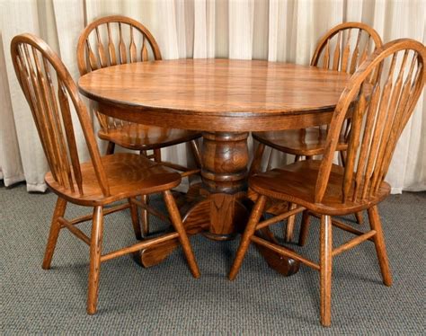Round Oak Pedestal Table And 4 Oak Arrow Back Chairs
