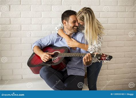Loving Couple With Guitar Stock Image Image Of Female 139933183