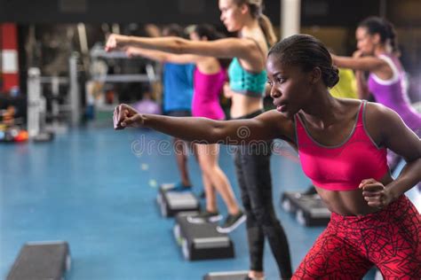 Female Athletic Exercising In Fitness Center Stock Photo Image Of