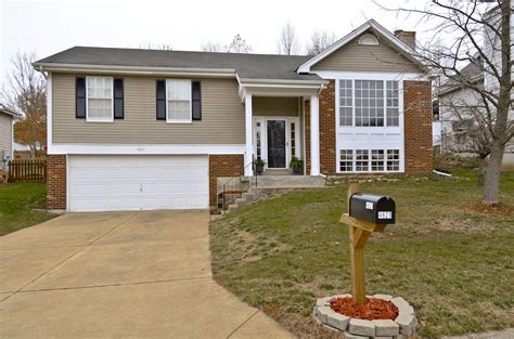 The exterior is composed of natural wood, brick, and large picture. Split Level | Split level house, Level homes, Home ...