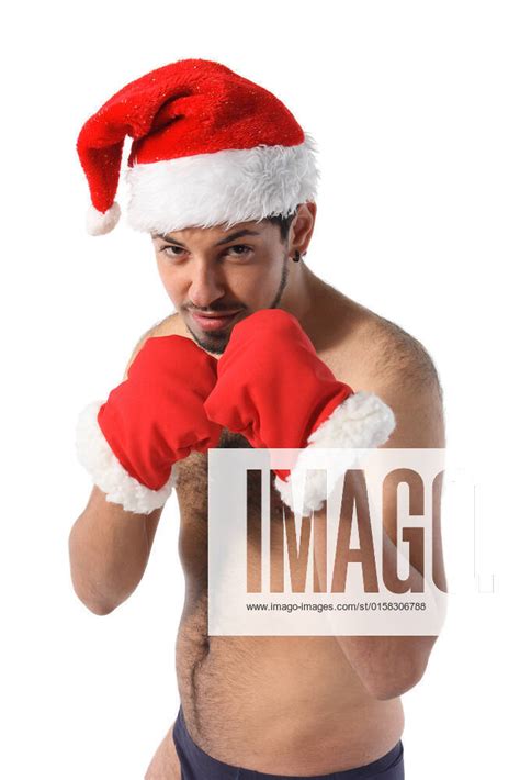 sexy muscular boxer wearing a santa claus hat isolated on white model released 2309031
